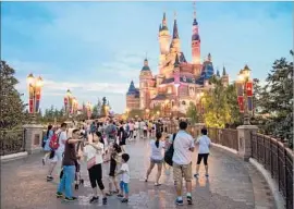  ?? David Swanson ?? WITH FEW obvious internal candidates, the board seems increasing­ly likely to look outside Disney for its next CEO. Above, at Shanghai Disneyland last year.