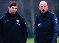  ??  ?? Steven Gerrard, centre, and assistant Gary McAllister