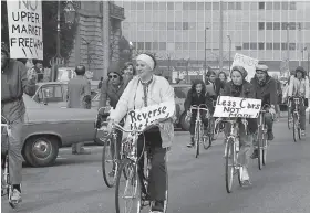  ?? Joe Rosenthal / The Chronicle 1972 ?? Left: Bicyclists seek a dedicated lane on Market Street during a 1972 protest outside San Francisco City Hall.