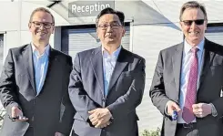  ?? ?? From left, Roland Bessey, operations director, Yuji Hayashi, finance director, with Graham Lowe, managing director, at the new Hochiki facility