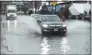  ?? Hearst Connecticu­t Media file photo ?? Vehicles splash through flooding in 2018 on Water Street in Norwalk.