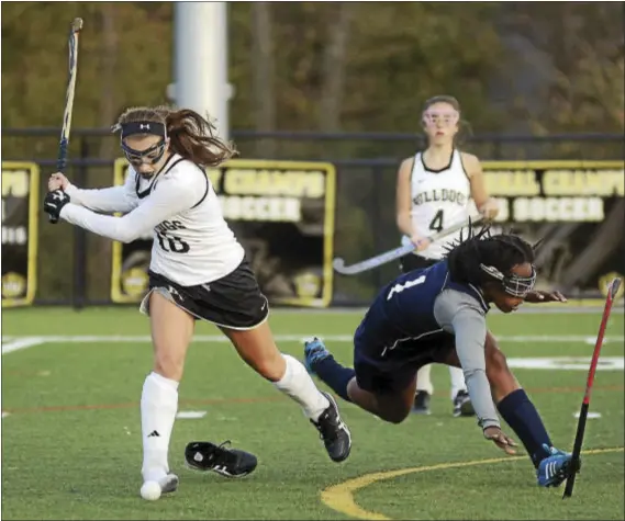  ?? GREGG SLABODA — TRENTONIAN PHOTO ?? Hopewell Valley’s Kelsey Fithen, left, takes a shot despite losing her shoe in front of Nottingham’s Sephora Innocent, right, during Tuesday