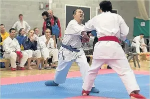  ??  ?? Hazim Yusof launches a punching attack against Gorka Garde from Lincoln Uni at the East Midlands Open championsh­ips.