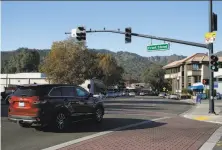  ?? Paul Chinn / The Chronicle ?? Traffic rolls at Front Street and Diablo Road in Danville, near the location where police shot Laudemer Arboleda, saying he was threatenin­g to ram them with his car.