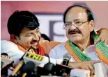  ??  ?? Union Minister M. Venkaiah Naidu and Delhi BJP chief Manoj Tiwari after their victory in the MCD polls