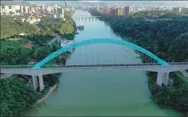  ?? PROVIDED TO CHINA DAILY ?? A train crosses a bridge on the China-Laos Railway in Yunnan province.