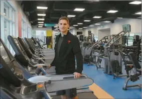  ?? The Okanagan Weekend ?? YMCA employee Andrey Federov stands on one of the 30 cardio machines at the YMCA’s new fitness centre in downtown Kelowna. Located inside the Interior Health’s new Community Health and Services Centre on Doyle Avenue, the gym held its grand opening on...