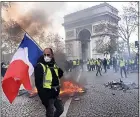  ??  ?? WARNING: The ‘gilets jaunes’ riots in Paris started over fuel