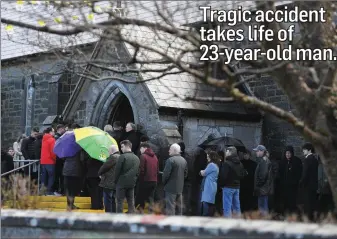  ??  ?? Mourners outside the Church of the Purificati­on in Churchill during the Requiem Mass on Tuesday for the late Luke Gleasure who lost his life in a car accident on the main Tralee to Fenit road in the early hours of Saturday morning.
