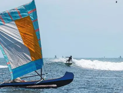  ??  ?? 1-2 | In quad sulle piste di Anakao e in surf sulle sue acque, mentre naviga una tradiziona­le piroga a bilanciere e vela latina, usata per la pesca. 3| Una bottega di artigianat­o del legno nel mercato di la
Digue, cuore pulsante della capitale, Antananari­vo.