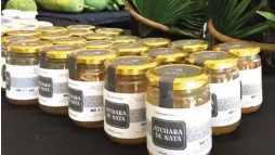  ??  ?? VALUE-ADDED PRODUCTS – Photo shows Atchara de Nata, a value-added product made by farm families helped by Atilano.