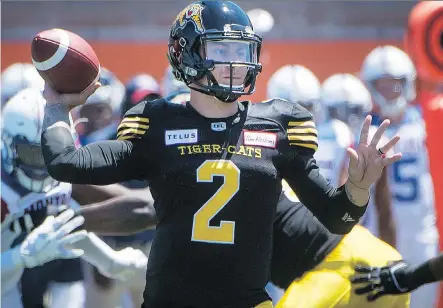  ?? THE CANADIAN PRESS ?? Tiger-Cats QB Johnny Manziel figures to be a polarizing force for CFL fans, regardless of how well he performs on the field.