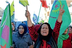  ?? AFP ?? Syrian Kurds demonstrat­e in Qamishli against Turkish shelling of Kurdish militia posts in Syria. —