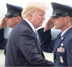  ?? AP ?? President Donald Trump boards Air Force One at Hagerstown Regional Airport in Maryland. Trump was returning to Bedministe­r, New Jersey, after having a meeting with his national security team at Camp David.