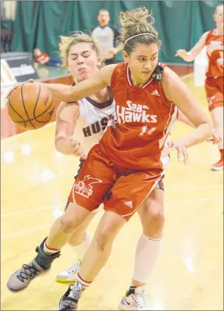  ?? KEITH GOSSE/THE TELEGRAM ?? The Memorial Sea-hawks’ Sydney Stewart drives to the net as Jada Yeo of the Saint Mary’s Huskies chases her down during AUS women’s basketball action at the MUN Field House Sunday afternoon. Stewart had 41 points overall — including 22 Sunday — as Memorial swept a pair of weekend games from visiting Saint Mary’s