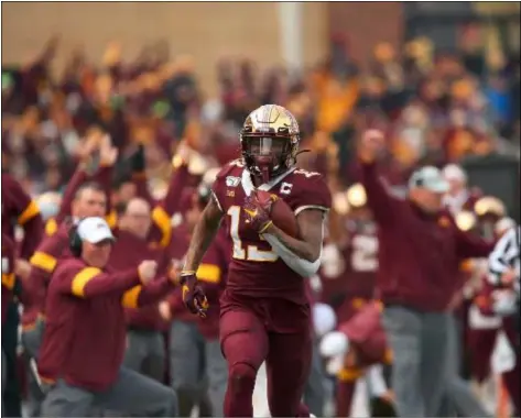  ?? STACY BENGS — THE ASSOCIATED PRESS ?? Minnesota wide receiver Rashod Bateman sprints down the field for a touchdown against Penn State. The Gophers found plenty of open spaced in the passing game in a 31-26win over the Nittany Lions.