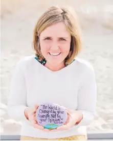  ?? DENISE BARKER ?? Megan Murphy searched beaches for heart-shaped rocks and pieces of beach glass, which she considered to be signs that her deceased parents were watching over her.