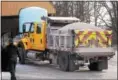  ?? GENE WALSH — DIGITAL FIRST MEDIA ?? A PennDOT truck in Norristown pulls away with a load of salt in preparatio­n of a snowstorm to hit the county.