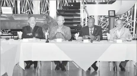  ??  ?? Clifford Reis (second from left) addressing the attendees as (from left) Executive member of the Private Sector Commission (PSC), Ramesh Dookhoo, Minister of State, Joseph Harmon and Chairman of the PSC, Eddie Boyer, listen. (Ministry of the Presidency...