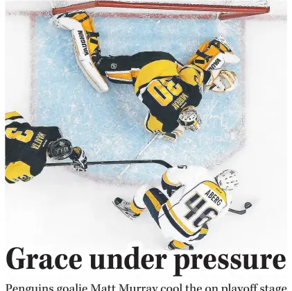  ??  ?? ABOVE: Nashville Predators’ Pontus Aberg prepares to shoot the puck past Pittsburgh Penguins goalie Matt Murray for a goal during the first period of Game 2 of the Stanley Cup Final on Wednesday in Pittsburgh.