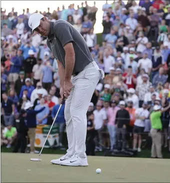  ?? DARRYL WEBB — THE ASSOCIATED PRESS ?? Scottie Scheffler putts on the 18th hole during the third round of the Phoenix Open golf tournament, Saturday, Feb. 11, 2023, in Scottsdale, Ariz. Scheffler leads the tournament at 13 under par.