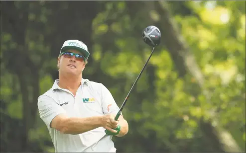  ?? Mike Ehrmann / Getty Images ?? Charley Hoffman plays his shot from the second tee during the first round of the Masters at Augusta National Golf Club on April 11 in Augusta, Ga.