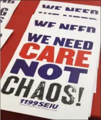  ??  ?? A sign is shown saying “we need care not chaos!”