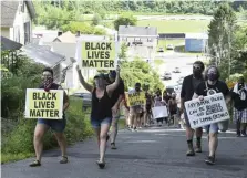  ?? AP ?? SHOWING WHAT MATTERS: Peaceful protesters march up Tyler Street in North Adams during a Black Lives Matter march on Sunday through the city.