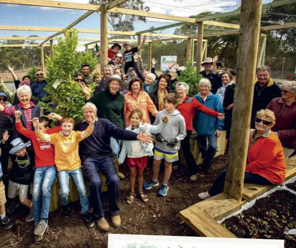  ??  ?? FROM ABOVE
e community members and volunteers who created the Parndana Community Garden, a reGrowth Garden Recovery project, celebrate its completion in March; an artist’s vision of the nished garden.