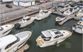  ??  ?? 3 BACKING UP Use nudges of astern with the wheel still to port, using small gear engagement­s to avoid building up momentum and allowing you to use all the space behind you. The wind on your stern will slow you.