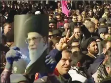  ?? AP PHOTO ?? This frame grab from video provided by Iran Press, a pro-government news agency based in Beirut, shows pro-government demonstrat­ors marching in, Arak, Iran yesterday.