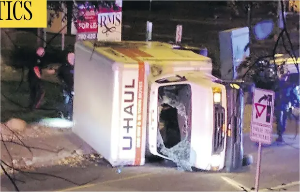  ?? MICHAEL MUKAI / AFP / GETTY IMAGES ?? A rental truck involved in an Edmonton terror attack lies on its side after a high-speed chase Saturday. Abdulahi Hasan Sharif, 30, was arrested.