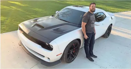  ?? VICTORIA SAPH ?? Val Saph, 34, with his beloved Challenger Hellcat, says he and his wife use only the red key.