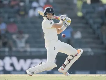  ??  ?? England batsman Joe Root cuts a ball to the boundary