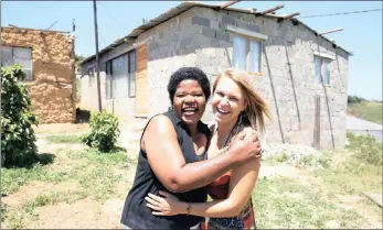  ?? PICTURE: ZANELE ZULU ?? HOME AND DRY: Single mother of two Phumelele Ndlovu celebrates the completion of her new home with her friend Tarryn Jolly, who launched the One Brick Project to raise funds and resources to rebuild it.