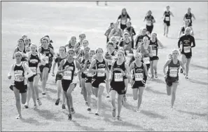  ?? The Sentinel-Record/MARA KUHN ?? Runners start down the course Saturday in the 6A girls state cross country meet at Oaklawn Park
in Hot Springs.