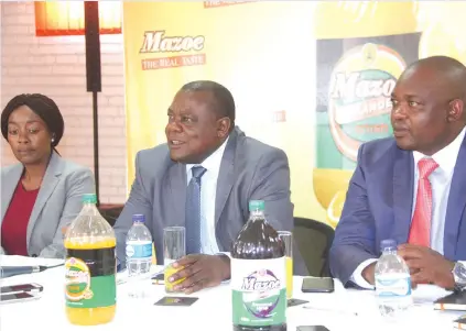  ?? — Picture by Justin Mutenda ?? Schweppes Zimbabwe managing director Charles Msipa (centre) flanked general manager Demos Mbauya and country manager Zimbabwe Coca Cola Noma Halimana at a press conference in Harare yesterday.