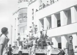  ?? AP FILE PHOTOS ?? A royalist tank moves into the courtyard of Tehran Radio a few minutes after pro-shah troops occupied the area during the CIA-backed coup that ousted Mohammad Mosaddegh and his government on Aug. 19, 1953.