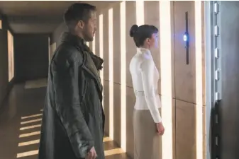  ?? Stephen Vaughan / Warner Bros. ?? Ryan Gosling and Sylvia Hoeks in “Blade Runner 2049,” a sequel made in a different time from the 1982 original. In the 21st century, the presence of AI gives the setting a different feeling.