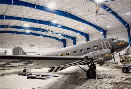  ?? Paul Buckowski / Times Union ?? A view of the Placid Lassie, a C-47 that flew in D-Day, is seen at The Hangar at 743 in Colonie..