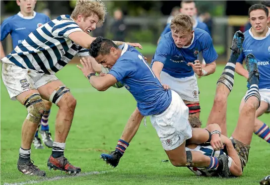  ?? PHOTO: ROBYN EDIE/FAIRFAX NZ ?? Southland Boys’ High School player Allan Gillies is tackled during the interschoo­l game against Otago Boys’ High School in Invercargi­ll.