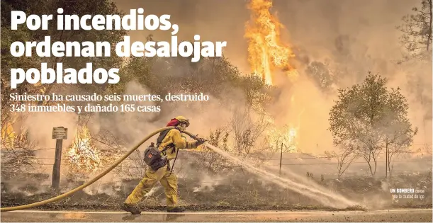  ??  ?? Un bombero cerca de la ciudad de Igo