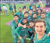  ?? ANI ?? Pakistan's Shaheen Shah Afridi (R) takes a selfie along with his teammates after beating India in Dubai on Sunday.