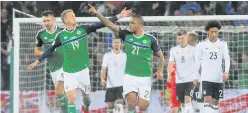  ??  ?? Josh Magennis celebrates his goal against Germany on Thursday night