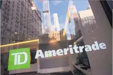  ?? MARK LENNIHAN ASSOCIATED PRESS ?? A Schwab office in New York is seen in this file photo as the company announced its acquisitio­n of TD Ameritrade Monday.