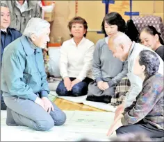  ??  ?? File photo shows Akihito (left) speaking with tsunami survivors at their makeshift shelter of Kamaishi junior high school in Kamaishi, Iwate prefecture.