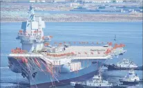  ?? PHOTO: REUTERS ?? Made in China . . . The first domestical­ly built Chinese aircraft carrier on show during its launching ceremony in Dalian.