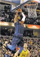  ?? MICHAEL CONROY/THE ASSOCIATED PRESS ?? Oklahoma City Thunder forward Paul George dunk in Wednesday’s game against the Pacers in Indianapol­is. George’s free throws in the final seconds helped seal the Thunder’s 100-95 victory.