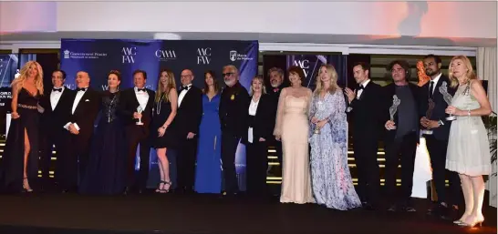  ??  ?? Autour du ministre d’État, mercredi soir, les lauréats des Fashion Awards réunis au Yacht-club ont donné le ton de cette sixième Fashion Week à la monégasque.