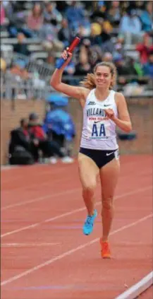  ?? MICHAEL REEVES — FOR DIGITAL FIRST MEDIA ?? Nicole Hutchinson celebrates Villanova’s x 1,500 relay at Franklin Field Friday. victory in the 4
